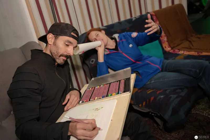 Artist at Work with Colored Pencils During Creative Downtime at VIECC 2018