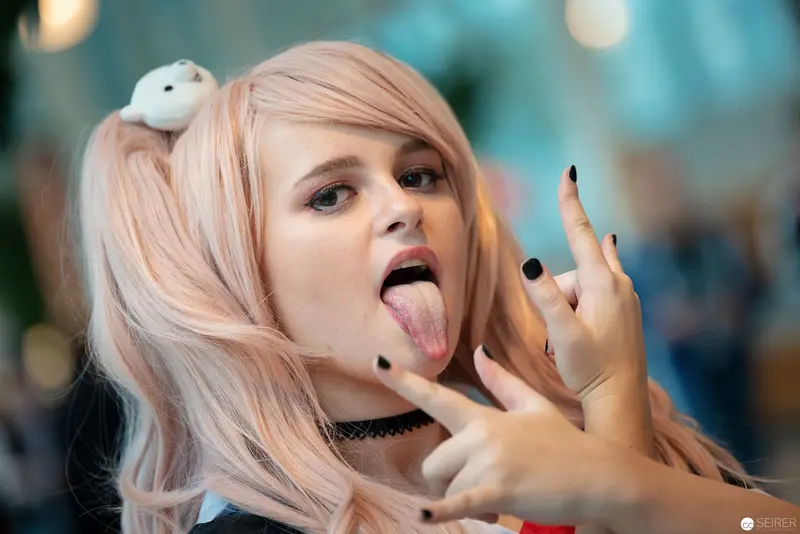 Cosplay Rebel with Playful Tongue-Out Gesture at Vienna ComicCon 2018