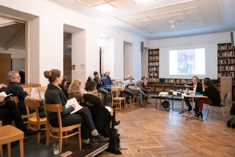Academic Seminar in Library Setting with Projection and Audience Engagement