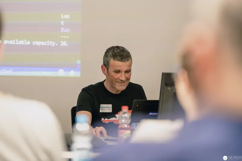 Conference Presenter Engaging Audience During Technical Presentation