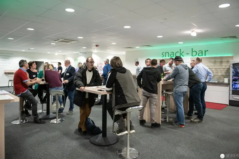 Corporate Networking Event at Minimalist Snack Bar with Professionals