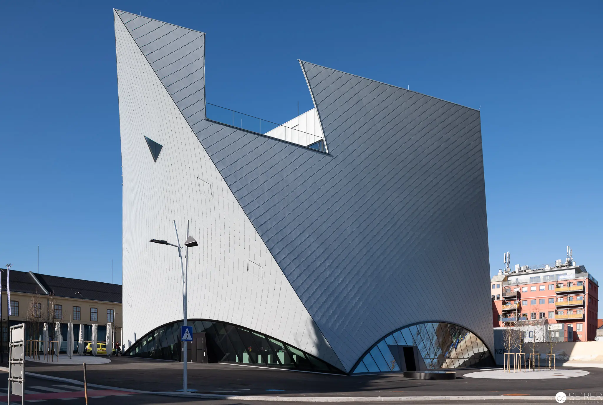 Contemporary Architectural Landmark with Dynamic Geometric White and Gray Facades