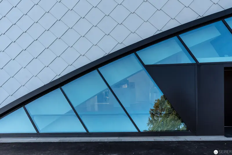 Geometric Architectural Abstraction with Blue Glass and Angled Surfaces