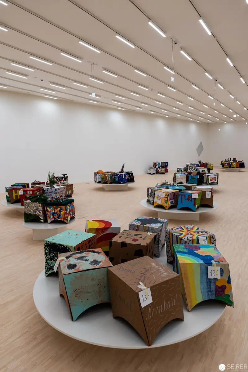 Sculptural Assemblage of Decorated Cubic Forms on Circular Gallery Platform