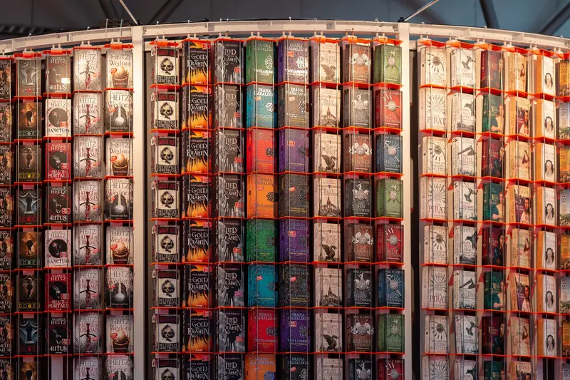 Dense Wall of Book Covers in Multicolored Grid Display