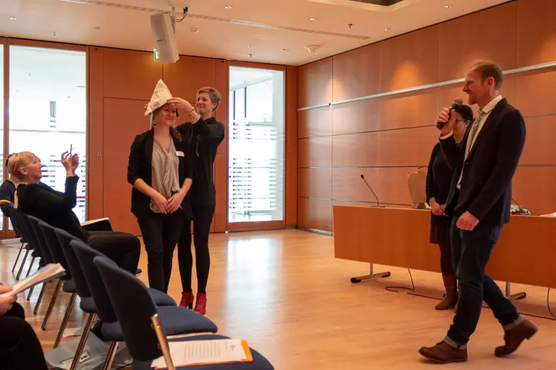 Legal Conference Interior: Participants in Minimalist Courtroom Setting