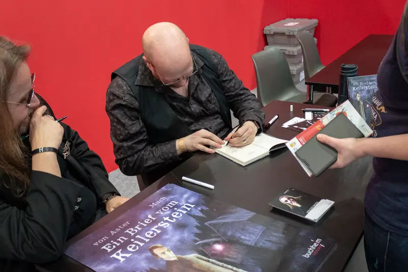 Book Signing Event with Author at Red-Walled Literary Venue