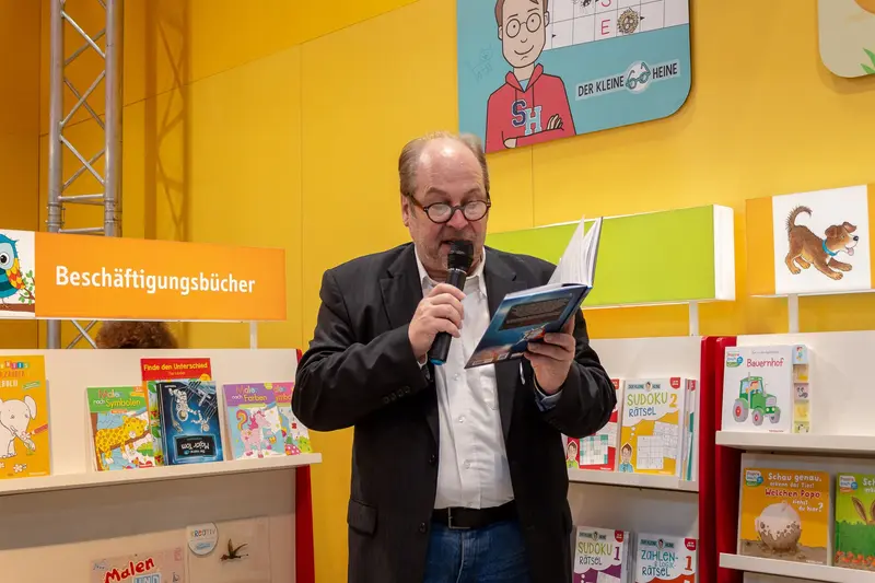 Author Presenting Children's Activity Book at Publishing Event