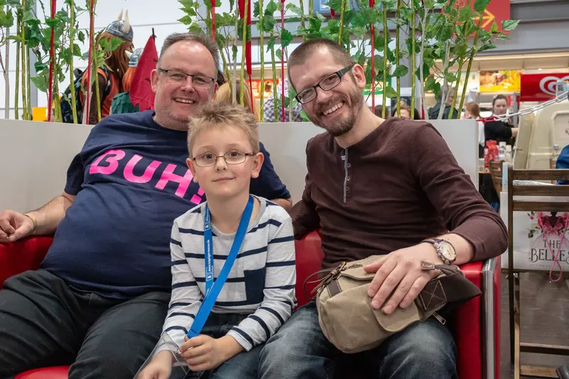 Three Generations: Casual Family Moment in Contemporary Urban Setting