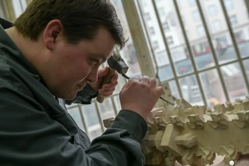 Stonemason from St. Stephan Cathedral Meticulously Crafting Architectural Detail