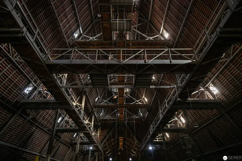 Intricate Industrial Architecture: Interior Structural Framework of Large Wooden Roof Construction