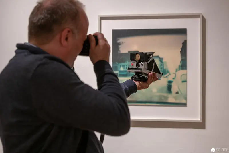 Photographer Captures Vintage Camera Artwork Through Lens at Gallery Exhibition