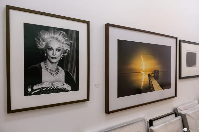Gallery Wall Display with Black and White Portrait and Sunset Landscape Photographs