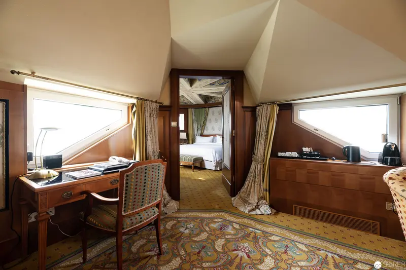 Bristol Hotel Wien: Luxurious Suite Interior with Ornate Carpet and Architectural Detailing