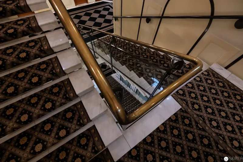 Geometric Staircase Descent with Brass Handrail at Hotel Bristol, Vienna