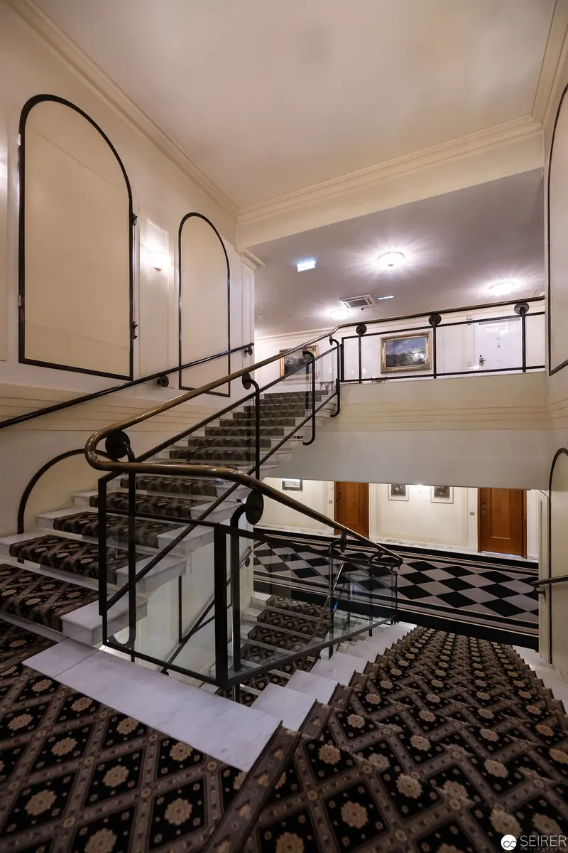 Monochromatic Staircase at Hotel Bristol, Vienna, Showcasing Architectural Elegance
