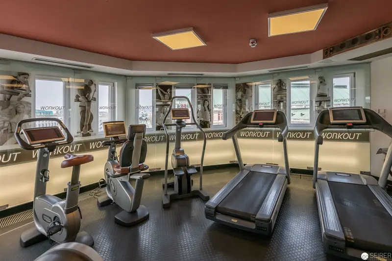 Modern Fitness Studio Interior with Treadmills and Exercise Equipment at Workout Facility