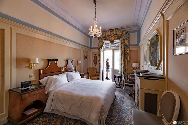 Elegant Hotel Bristol Vienna Room with Crystal Chandelier and Ornate Decor