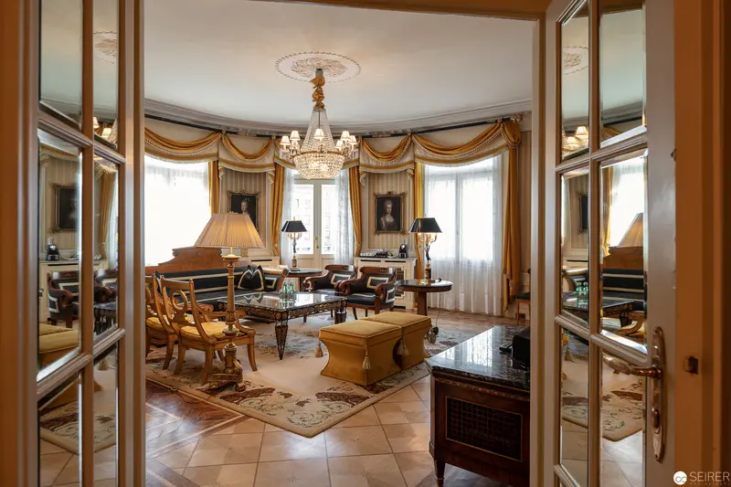 Opulent Victorian Drawing Room with Crystal Chandelier and Elegant Furnishings