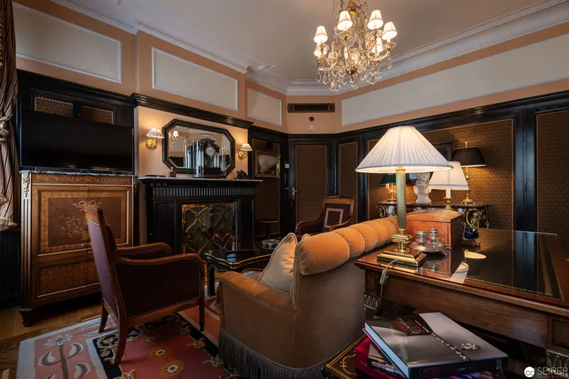 Luxurious Late 19th-Century Interior with Ornate Chandelier and Period Furnishings