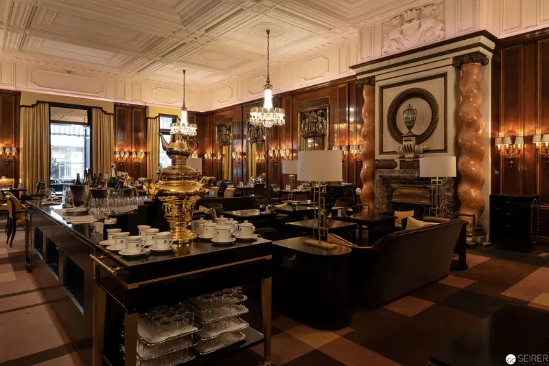 Luxurious Hotel Bristol Salon with Ornate Chandeliers and Elegant Dining Setup