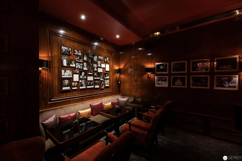 Intimate Wood-Paneled Media Room with Vintage Photographic Wall Display
