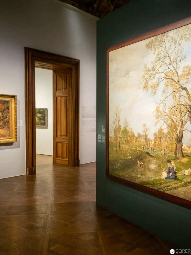 Museum Gallery Interior with Landscape Painting and Wooden Door
