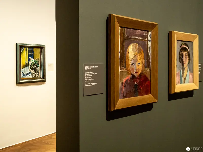 Gallery Wall Display of Portrait Paintings in Wooden Frames