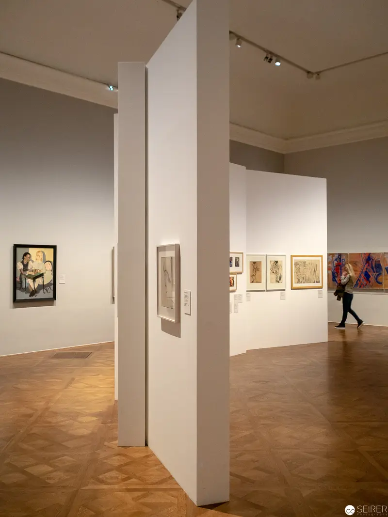 Art Gallery Interior with White Partition Walls and Wooden Parquet Flooring
