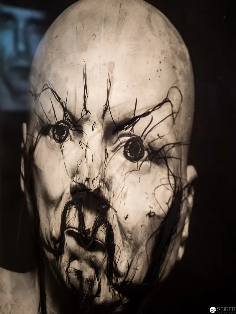 Fragmented Anthropomorphic Sculpture: Distorted Cranial Form with Expressive Surface Textures