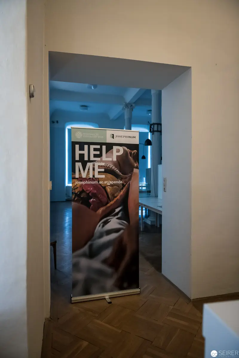 Help Me Campaign Poster Displayed in Architectural Interior Passageway