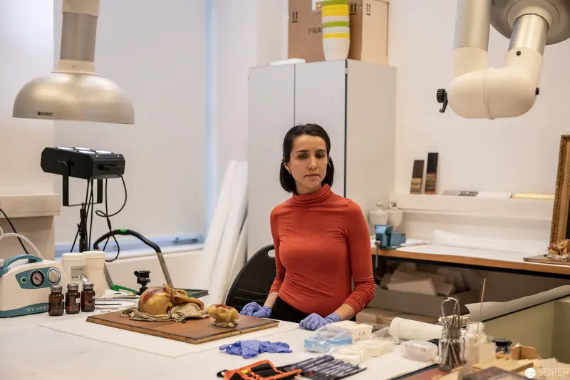 Scientific Laboratory Setting with Researcher in Red Turtleneck