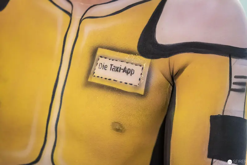 Stylized Yellow Torso with "Die Taxi-App" Label in Graphic Design Study