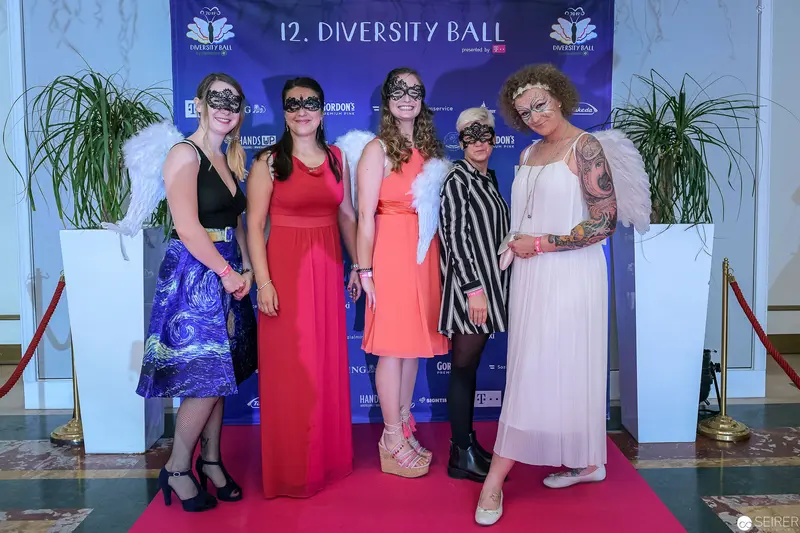 Five Women in Masquerade Masks at 12th Diversity Ball Photocall