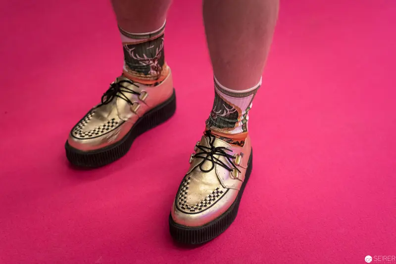 Gold Creeper Shoes with Checkered Pattern on Vivid Pink Background