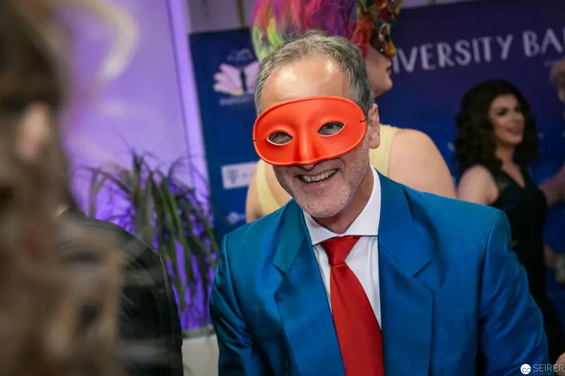 Masked Gentleman in Blue Suit at University Event Masquerade
