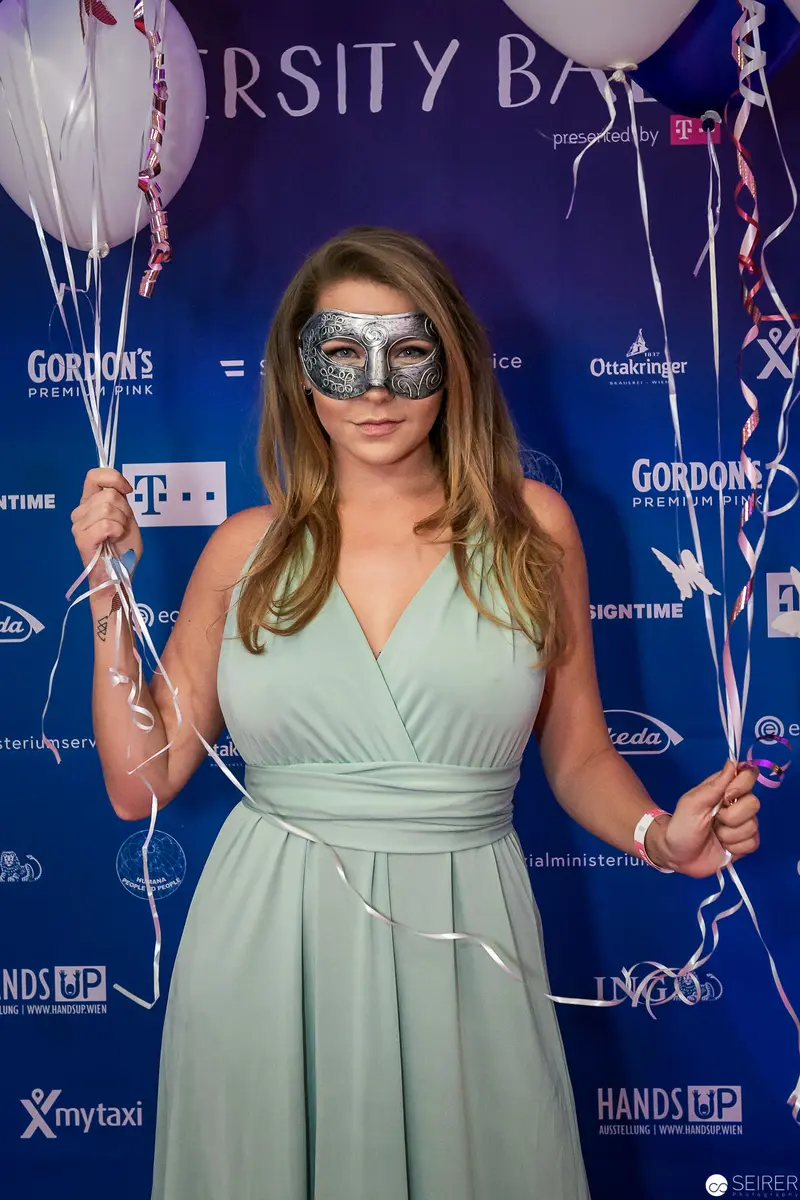 Masked Woman in Mint Dress at Varsity Ball Photographic Backdrop
