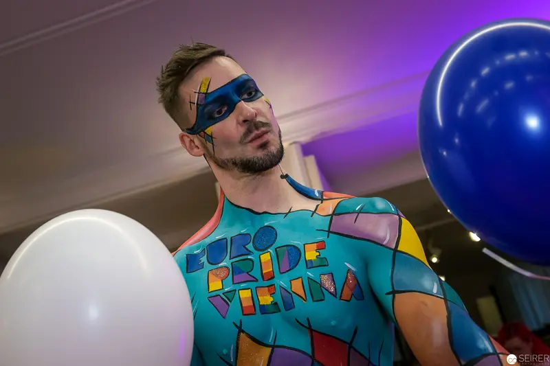 Pride Vienna Body Painting Performance with Colorful Balloons and Masked Performer