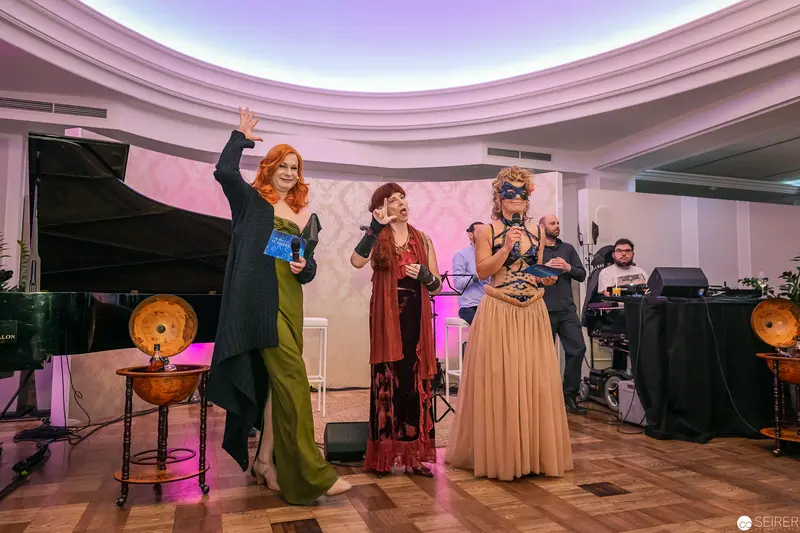 Performance Stage with Three Performers in Stylized Evening Attire