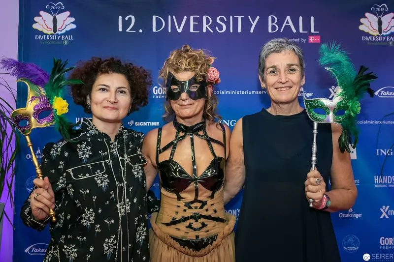 Three Attendees with Ornate Masks at 12th Diversity Ball Photocall