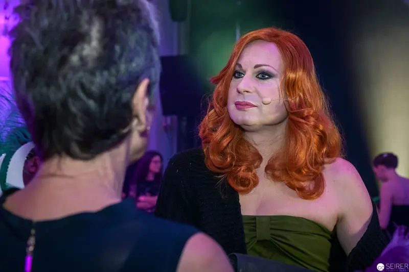 Evening Social Event with Elegant Redheaded Woman in Green Strapless Dress