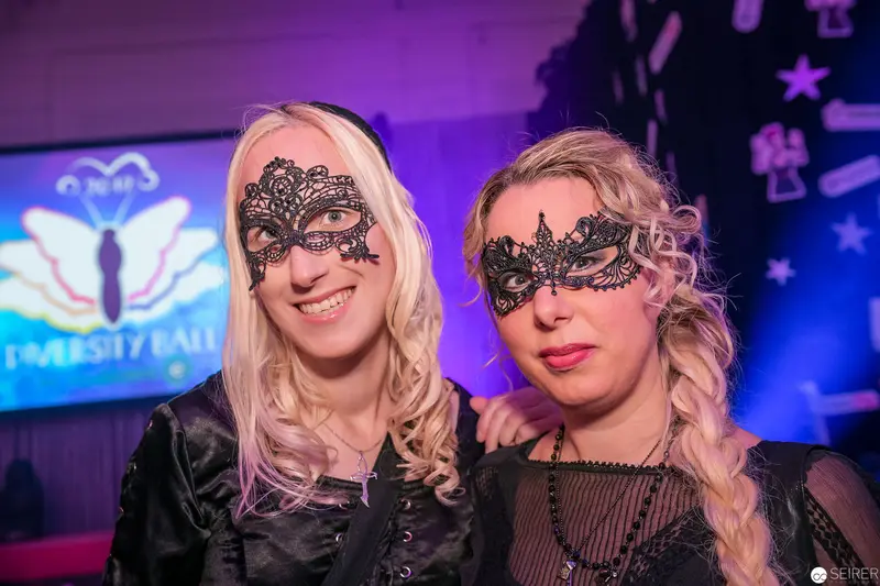 Masked Women at University Ball in Elaborate Lace Eyewear