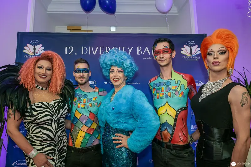 Five Drag Performers Posing at 12th Diversity Ball Event Backdrop