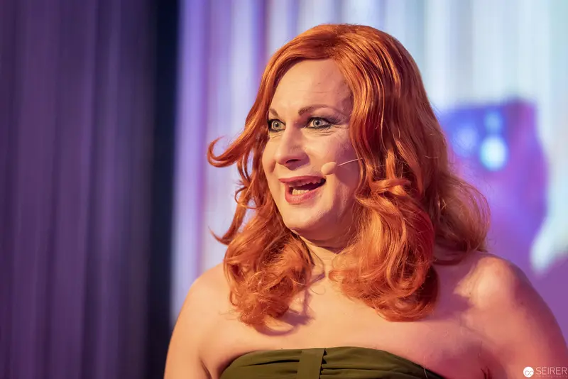 Performance Portrait: Drag Performer in Olive Strapless Gown with Vibrant Copper Hair