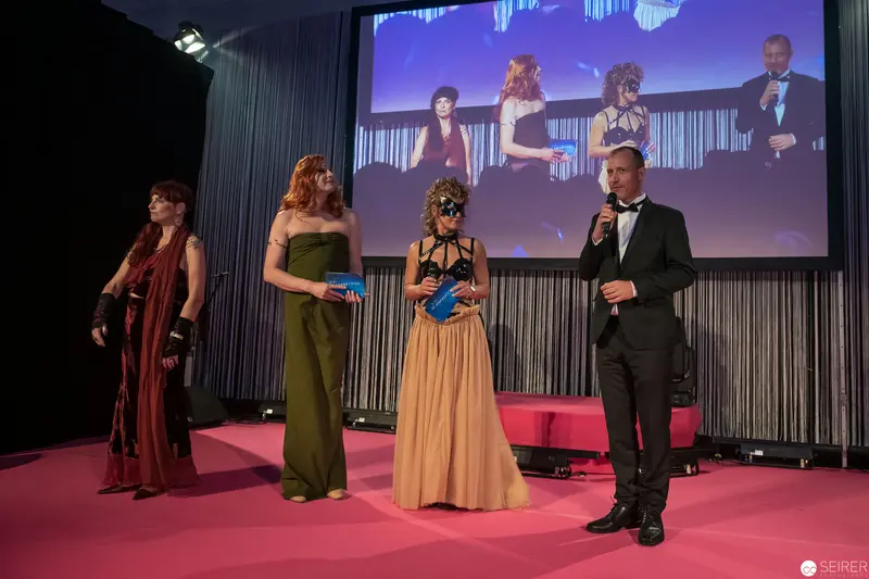 Gala Event Stage Presentation with Elegant Performers in Formal Attire