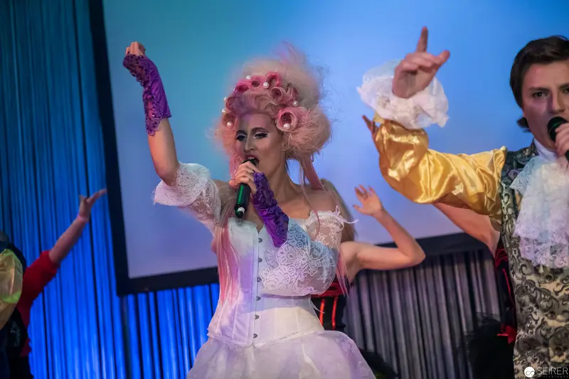 Drag Performance with Vibrant Vocalist in Pink Wig and Corset