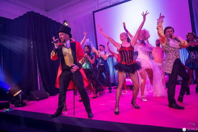 Theatrical Cabaret Performers in Vibrant Choreographed Stage Performance