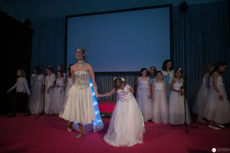 White Dress Fashion Show with Illuminated Runway and Performers