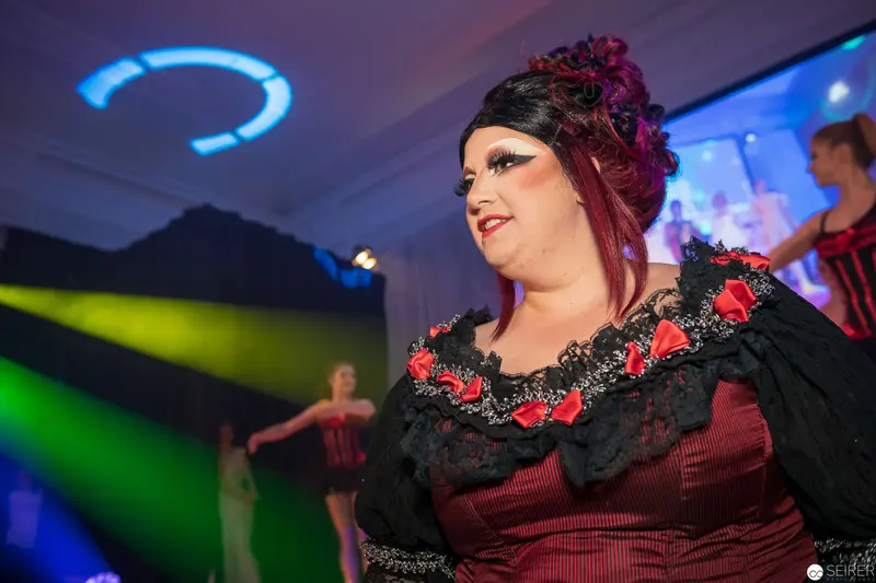 Performance Stage with Woman in Red and Black Theatrical Costume