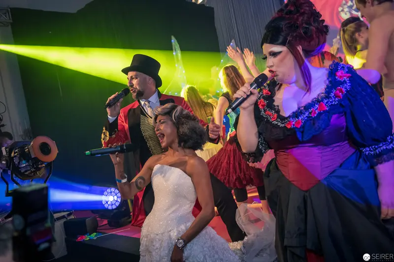 Wedding Performance with Energetic Singers and Dramatic Stage Lighting